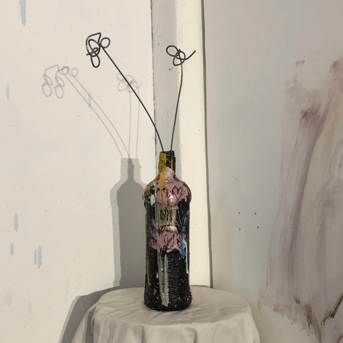 Painted Bottle Vase. 2025. Bitumen and oil paint on glass bottle.
